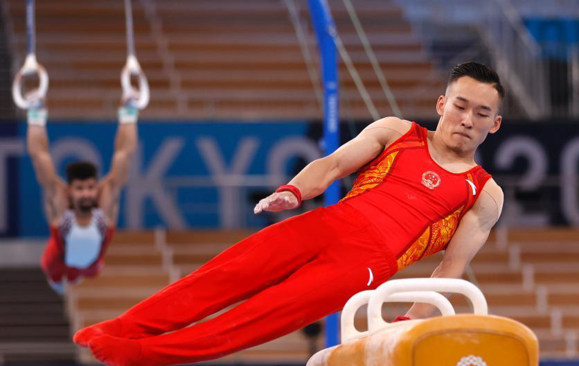 Қытай спортшылары Токиодағы Ариаке гимнастика аренасында жаттығуда